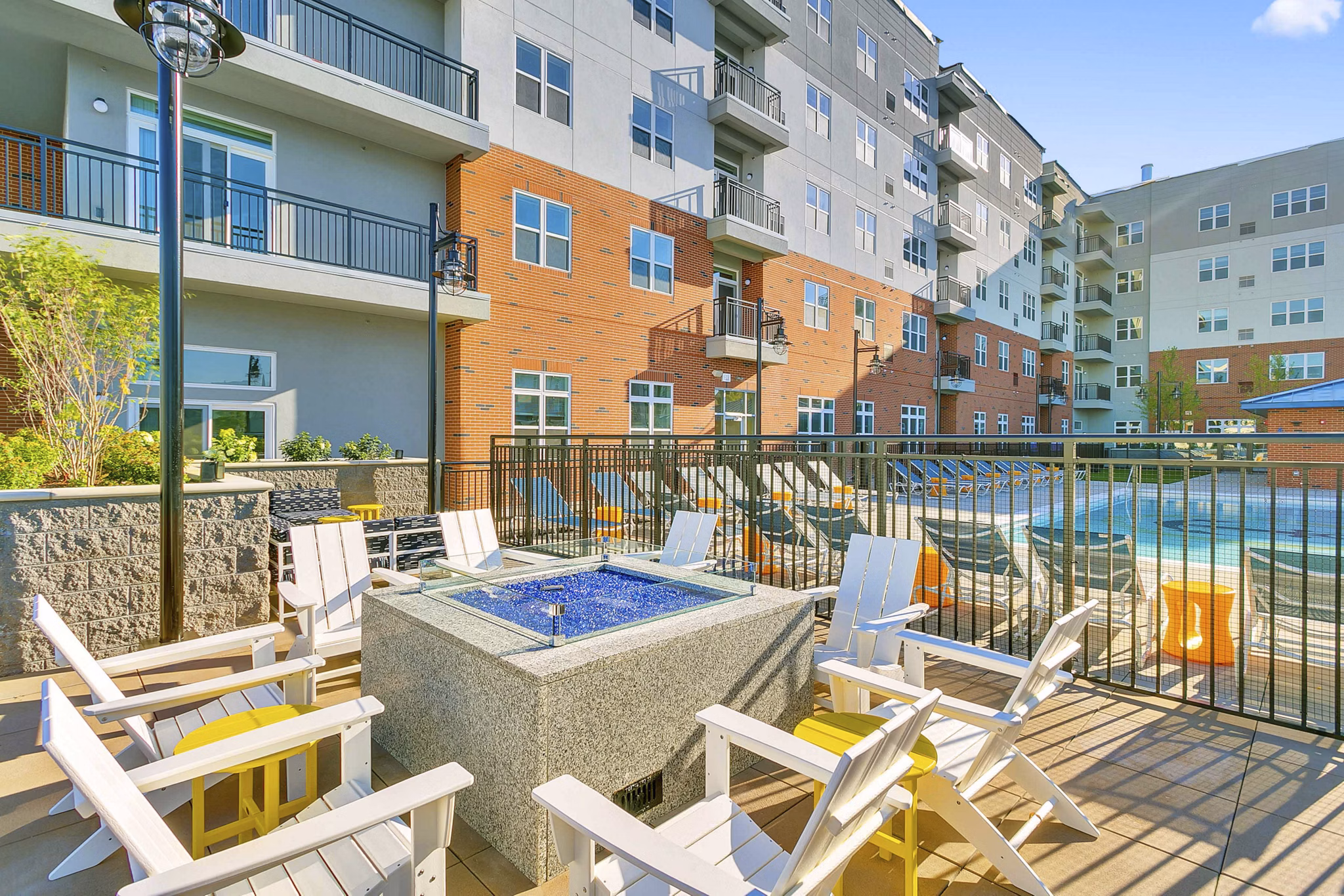 Fire pit at Harbor Landing Apartments: Cozy outdoor seating area with ambient lighting, perfect for relaxing evenings by the water