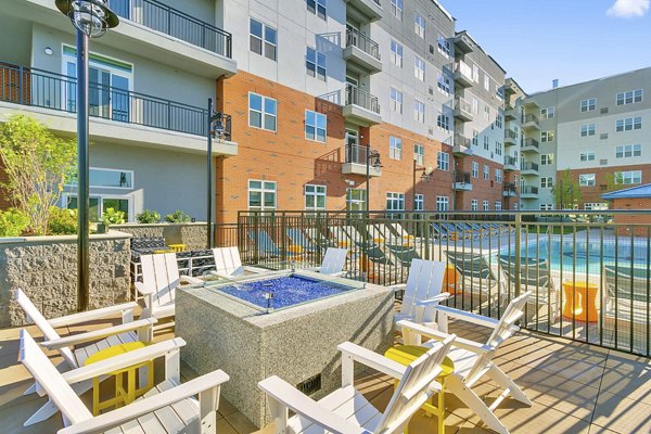 Fire pit at Harbor Landing Apartments: Cozy outdoor seating area with ambient lighting, perfect for relaxing evenings by the water