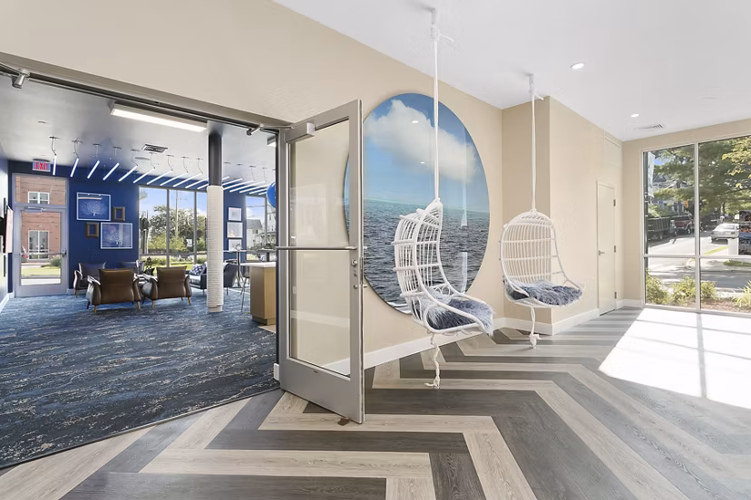 Harbor Landing Apartments: Cozy patio with outdoor seating and lush greenery