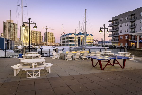 Scenic rooftop deck with modern seating and water views at Harbor Landing Apartments