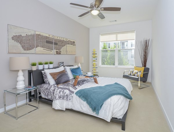 Cozy bedroom with modern decor at 75 Tresser Apartments