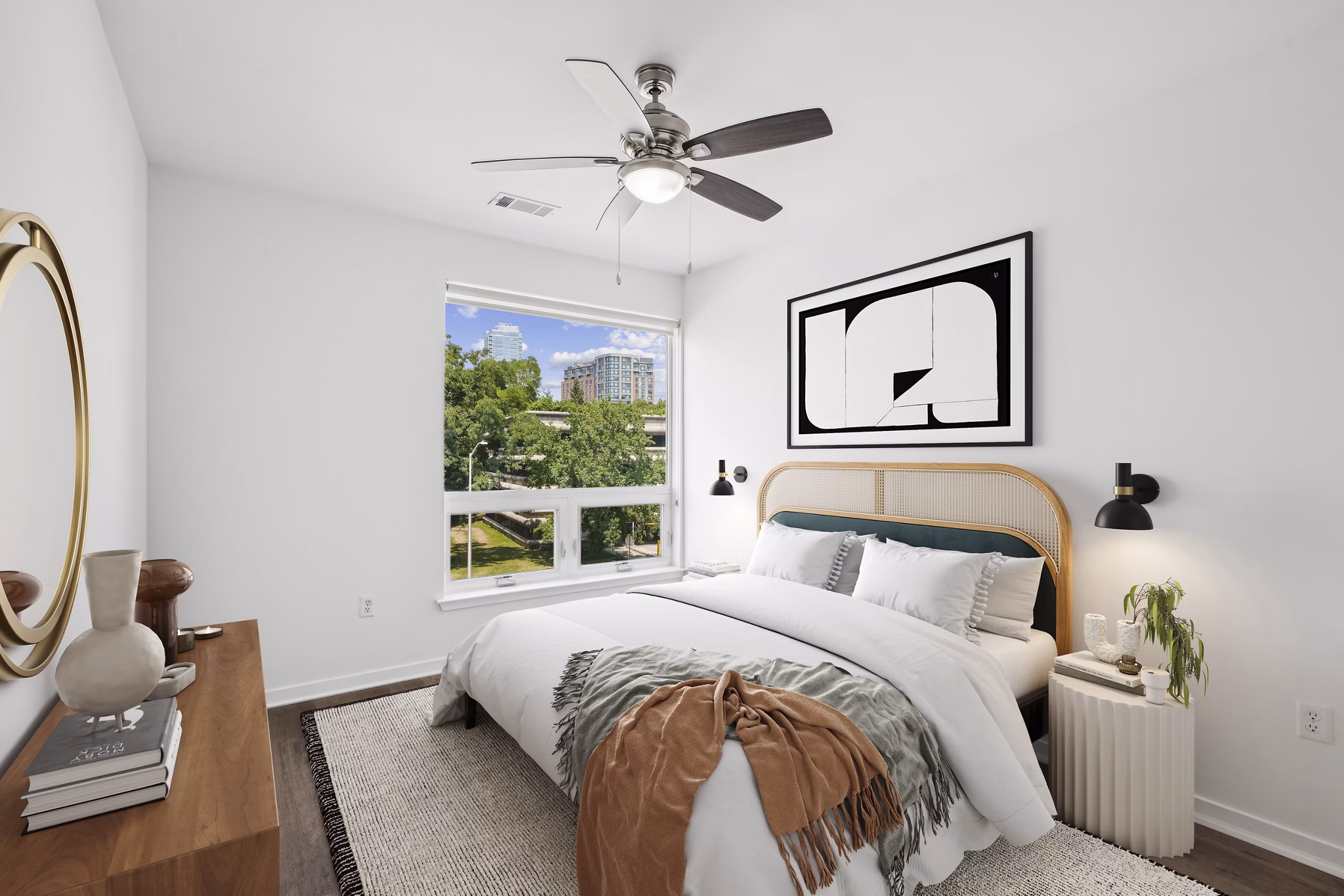 Modern bedroom featuring a cozy bed, nightstand, and wall art in luxury apartment setting