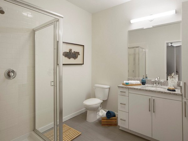 Modern bathroom with sleek fixtures at 75 Tresser Apartments, a Greystar luxury property featuring premium design elements