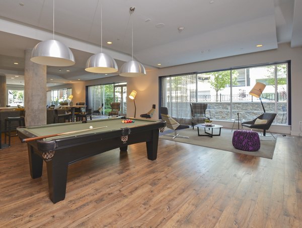 Clubhouse featuring modern decor and seating at 75 Tresser Apartments, a luxury living community