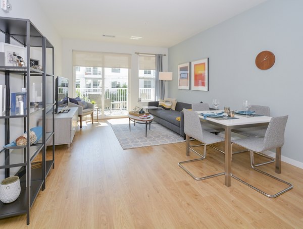 Dining area with modern furnishings and natural light at 75 Tresser Apartments, luxury living in Stamford