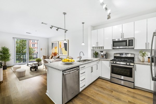 Modern kitchen with stainless steel appliances at 75 Tresser Apartments