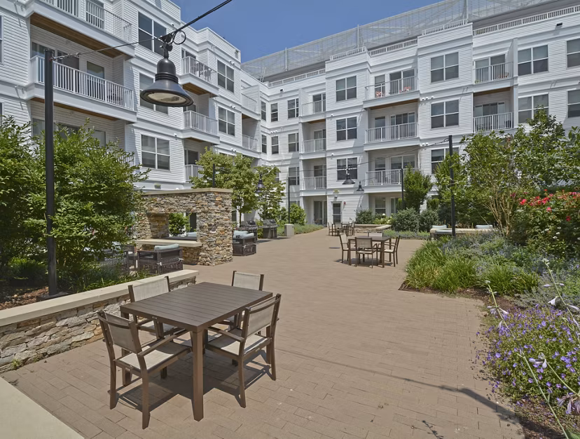 Outdoor patio/balcony with modern seating at 75 Tresser Apartments, providing relaxation space for residents in Stamford
