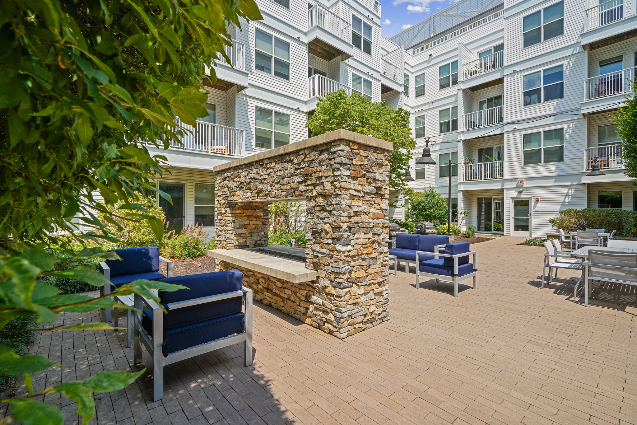 Outdoor fire pit and patio at 75 Tresser Apartments
