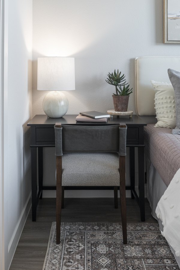 Modern bedroom with sleek furnishings in Prose Solaire Apartments, featuring luxury Greystar design