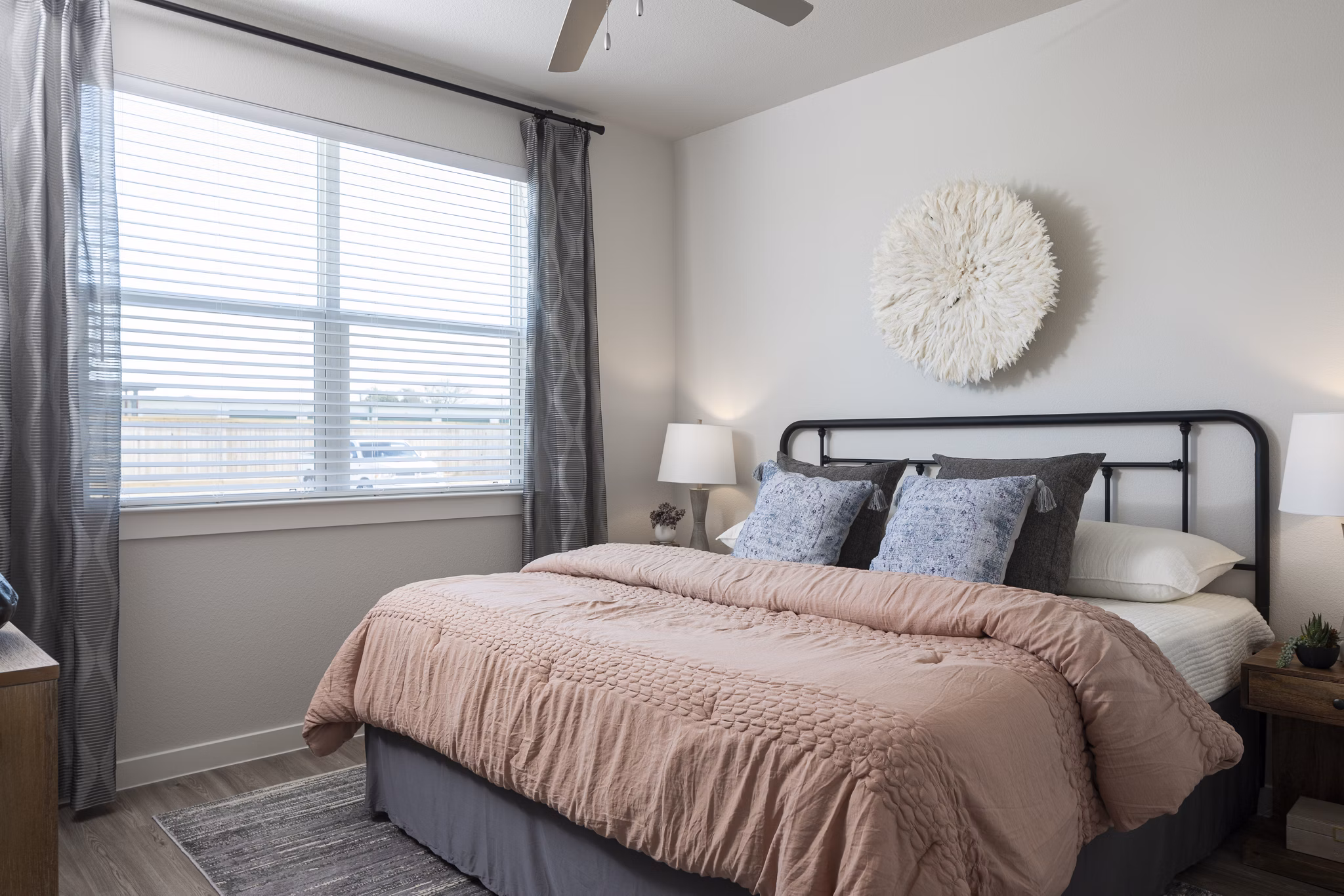 Cozy bedroom with modern design in Prose Solaire Apartments, featuring stylish furnishings and natural light