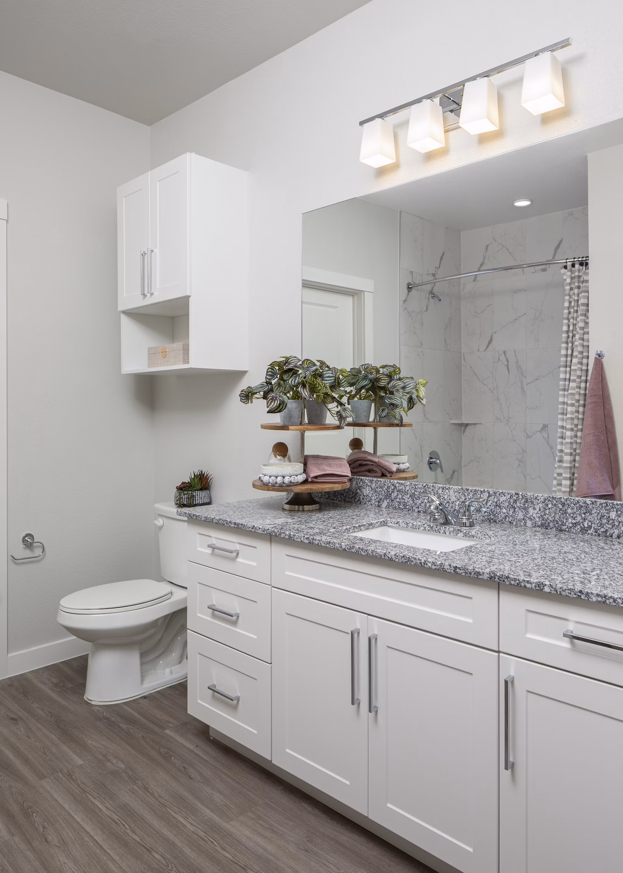 Stylish bathroom with modern fixtures at Prose Solaire Apartments