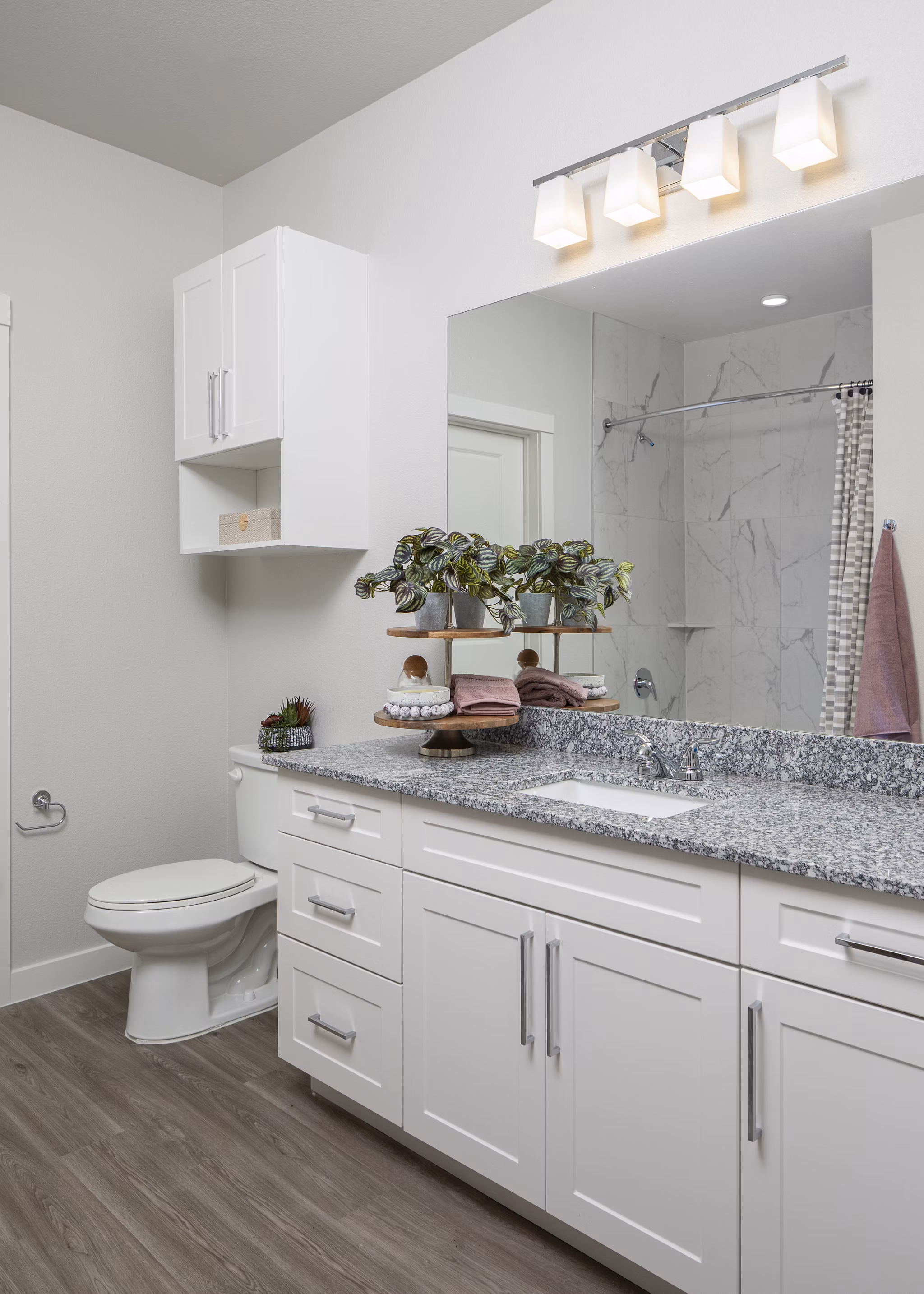 Stylish bathroom with modern fixtures at Prose Solaire Apartments