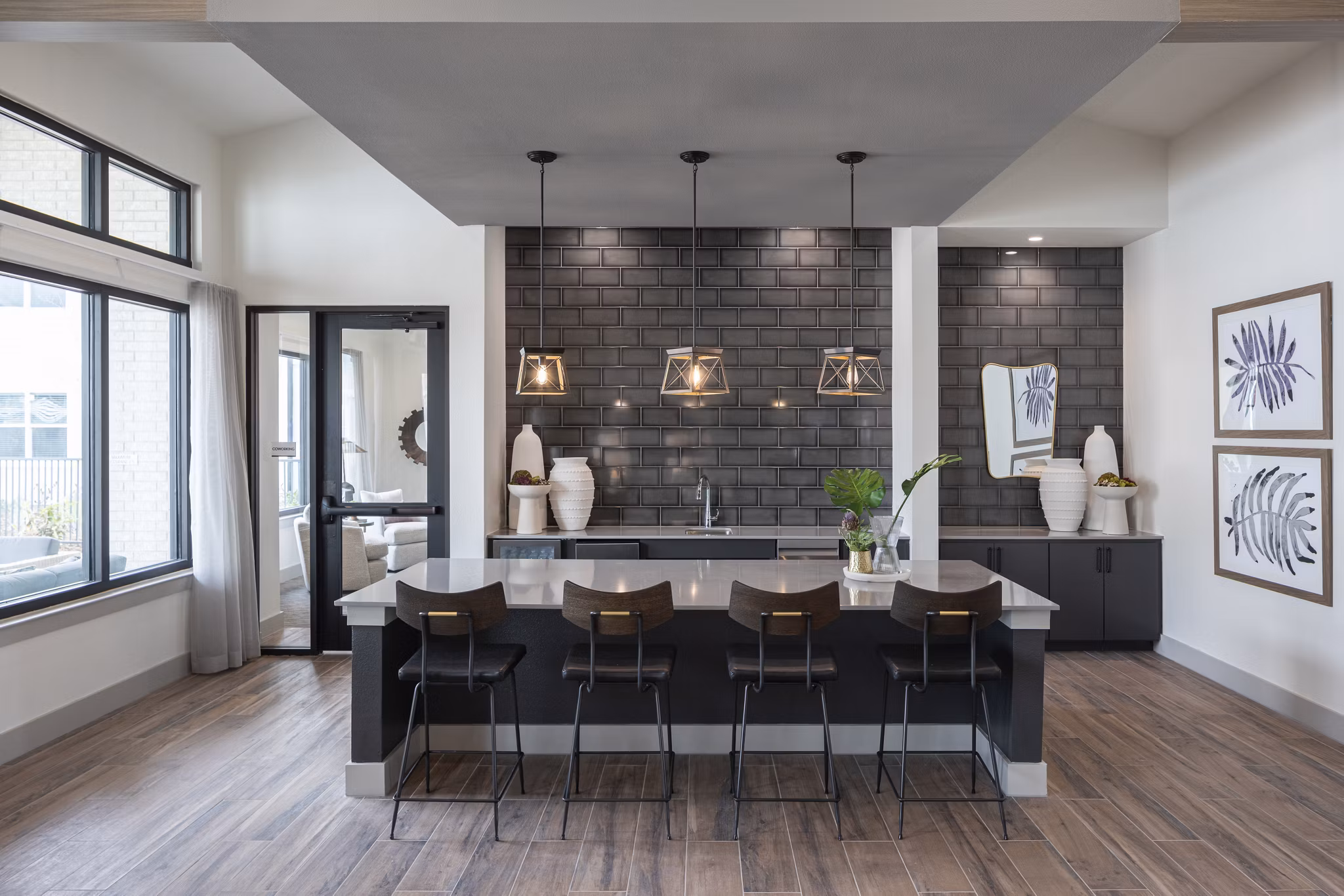Modern clubhouse with open seating areas at Prose Solaire Apartments, offering luxury community amenities in a welcoming environment