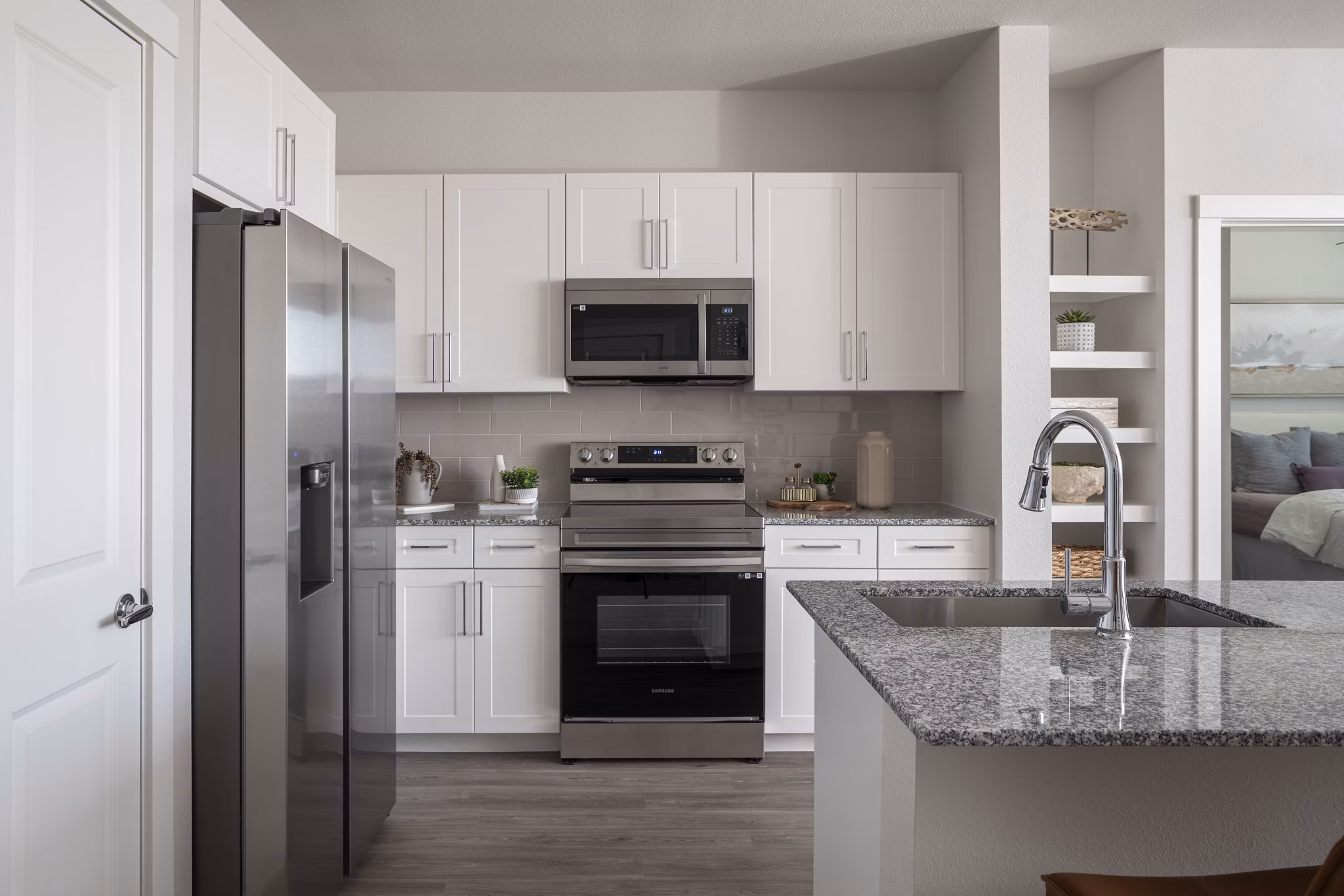 Modern kitchen with stainless steel appliances at Prose Solaire Apartments