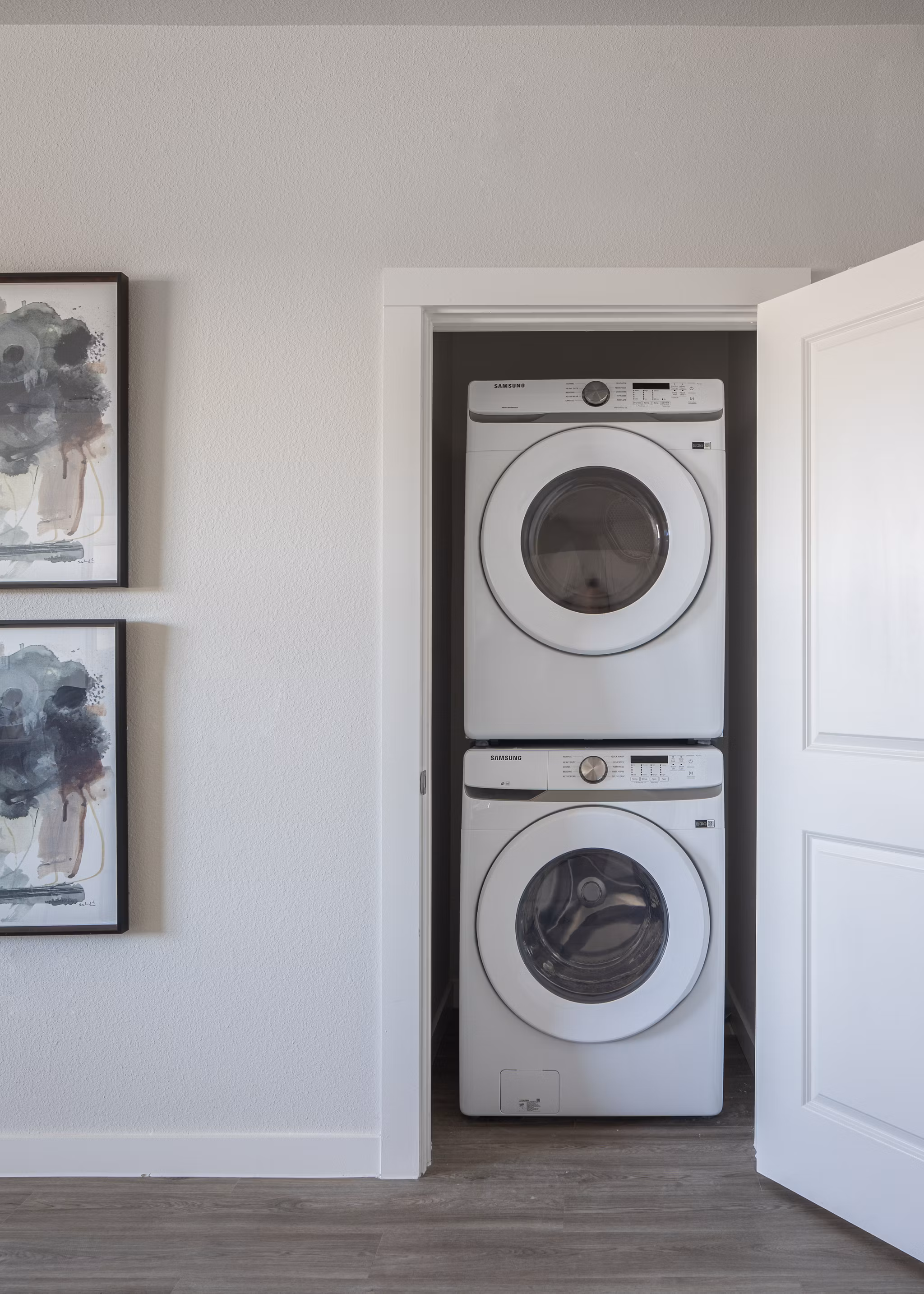 Modern laundry room with high-efficiency washers and dryers at Prose Solaire Apartments, a Greystar luxury community