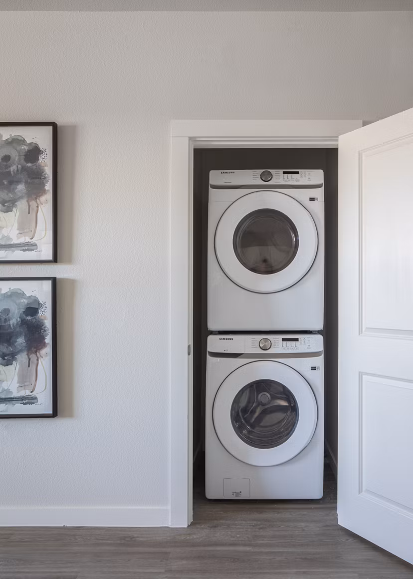Modern laundry room with high-efficiency washers and dryers at Prose Solaire Apartments, a Greystar luxury community