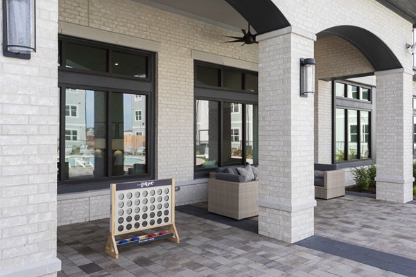 Elegant outdoor patio with cozy seating at Prose Solaire Apartments, perfect for relaxation and gatherings