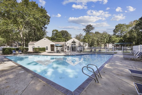 Modern pool area with lounge chairs at Luna Pointe Apartments