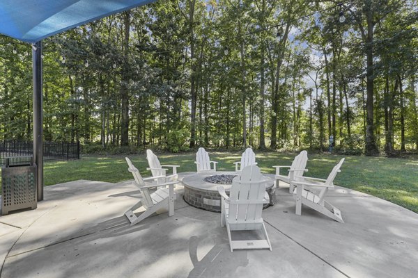 Fire pit lounge area at Luna Pointe Apartments, offering cozy outdoor seating for relaxation and socializing