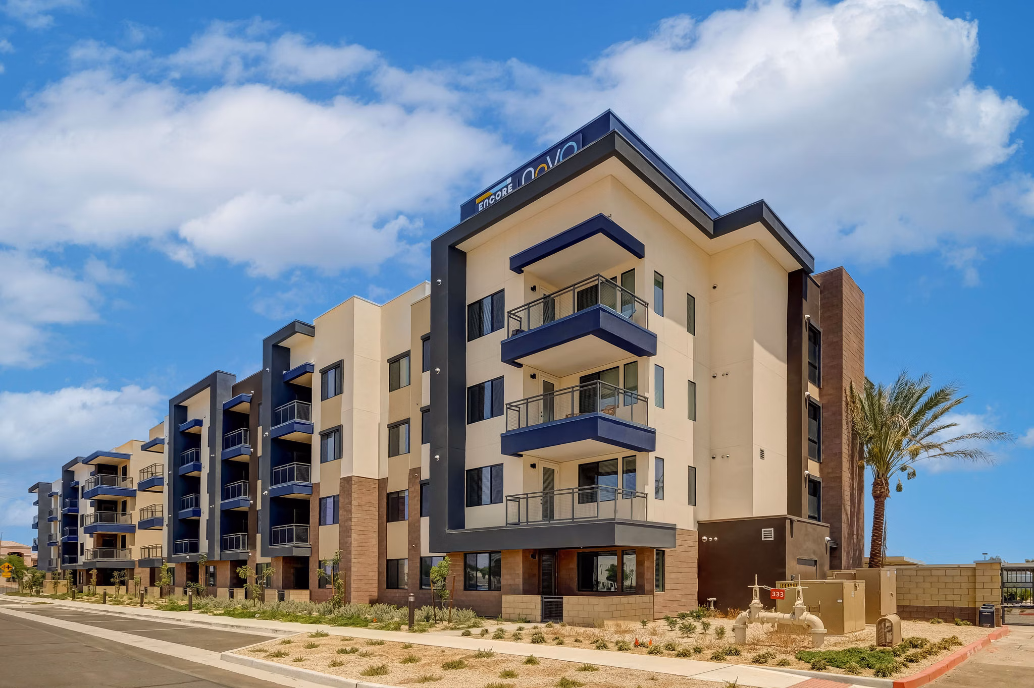 Encore Novo Apartments: Elegant brick facade of luxury apartment building in urban setting