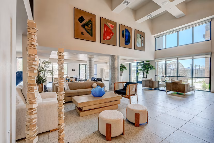 Elegant lobby with modern seating at Encore Novo Apartments, showcasing luxury design and comfort for residents
