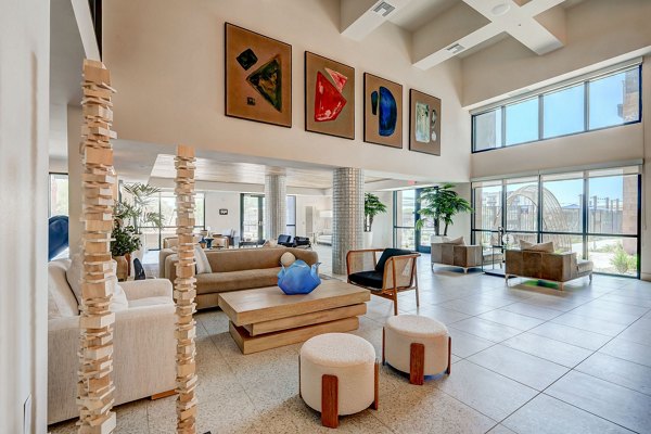 Elegant lobby with modern seating at Encore Novo Apartments, showcasing luxury design and comfort for residents