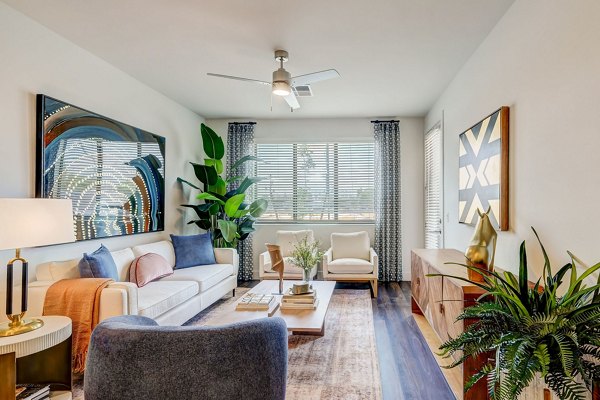 Spacious living room with modern decor at Encore Novo Apartments, Greystar luxury homes in an elevated lifestyle setting