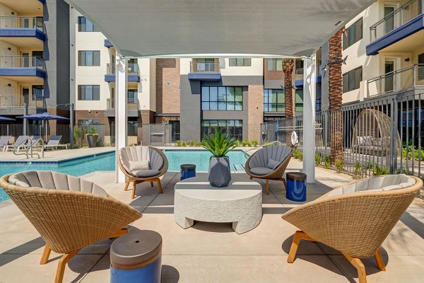 Chic outdoor patio space with seating at Encore Novo Apartments