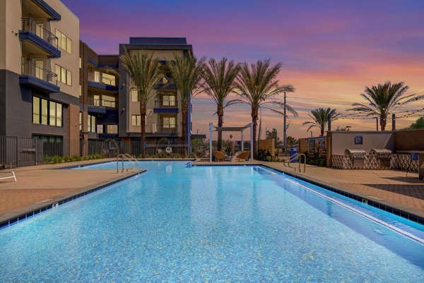 Luxurious outdoor pool area at Encore Novo Apartments offering relaxation and leisure