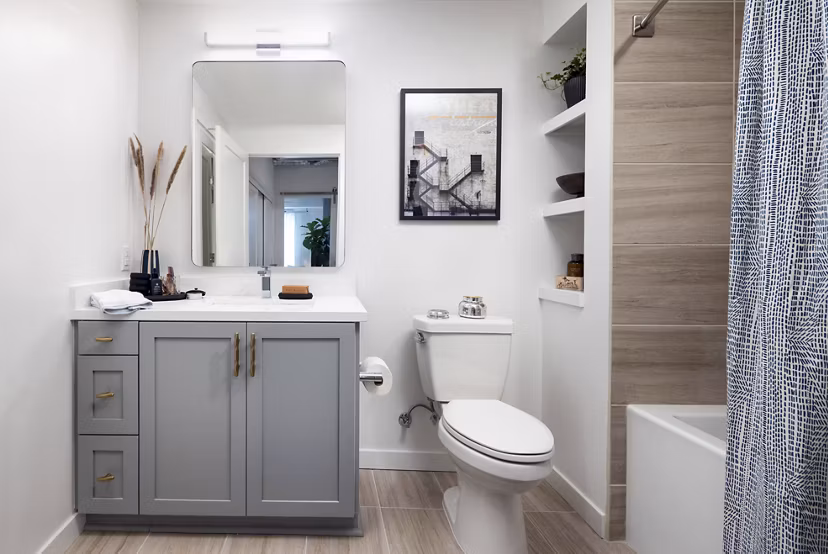 Bathroom with sleek fixtures and marble countertops at Broadstone Inkwell Apartments, luxury living by Greystar