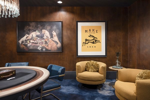 Clubhouse game room featuring billiards and lounge seating at Broadstone Inkwell Apartments