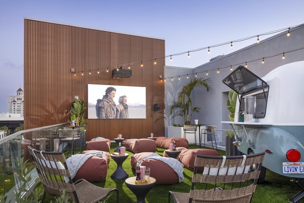 Modern clubhouse featuring theater and outdoor patio at Broadstone Inkwell Apartments Perfect for luxury living and social gatherings