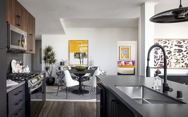 Kitchen with modern appliances and quartz countertops at Broadstone Inkwell Apartments