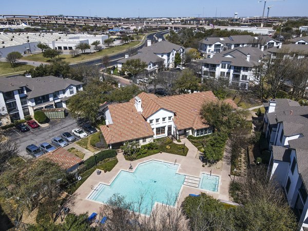 builiding/exterior/pool at Legends Lake Creek Apartments