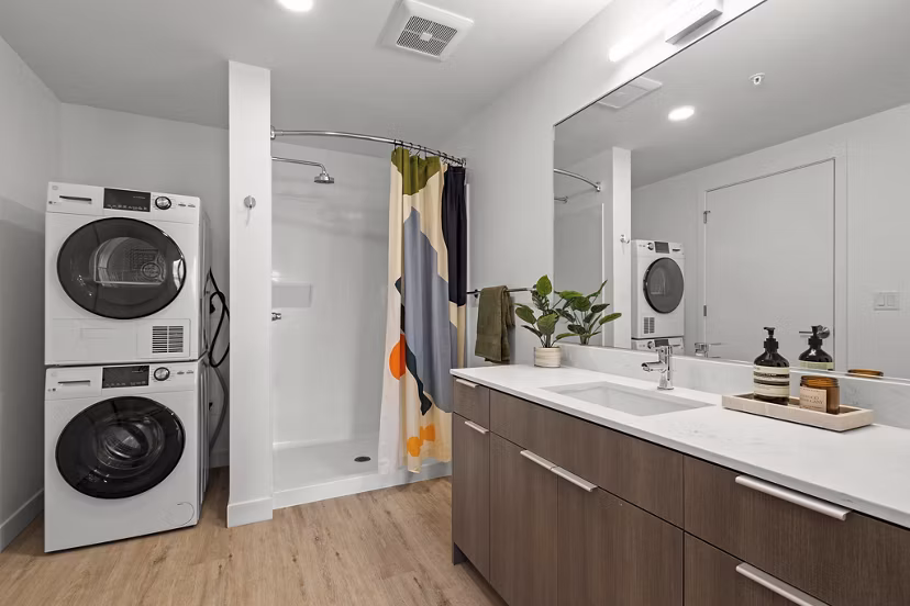 Luxurious bathroom with marble finishings and modern fixtures in Skyglass Apartments