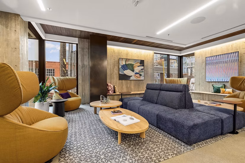 Skyglass Apartments: Modern clubhouse featuring sleek design and comfortable seating areas