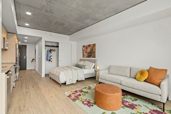 Elegant dining area with modern lighting fixtures in Skyglass Apartments