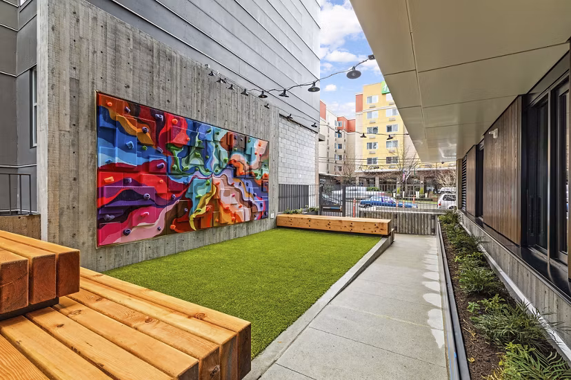 Expansive dog park featuring play areas and benches at Skyglass Apartments