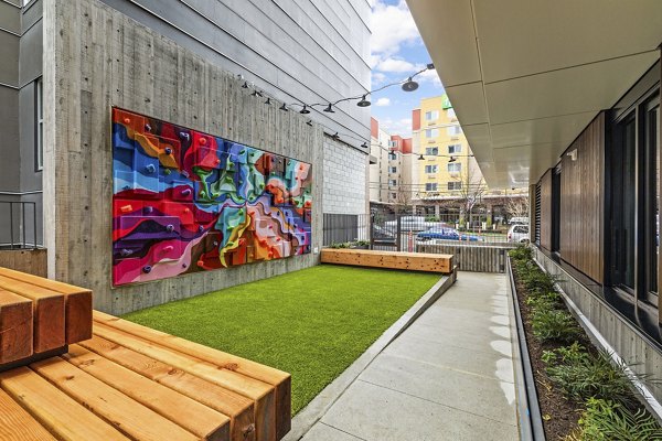 Expansive dog park featuring play areas and benches at Skyglass Apartments