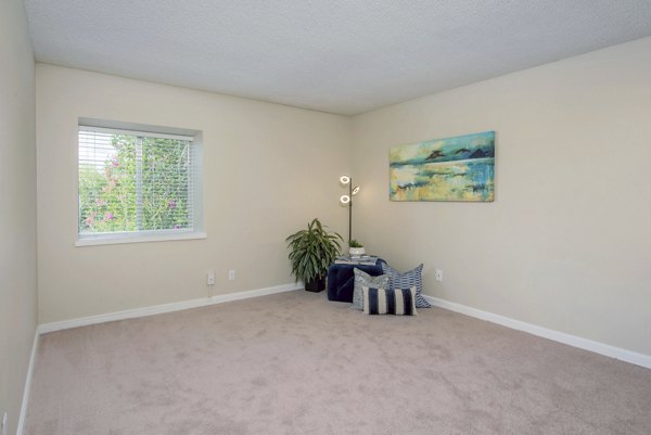 Cozy bedroom featuring modern furnishings at Westmount at Winter Park Apartments