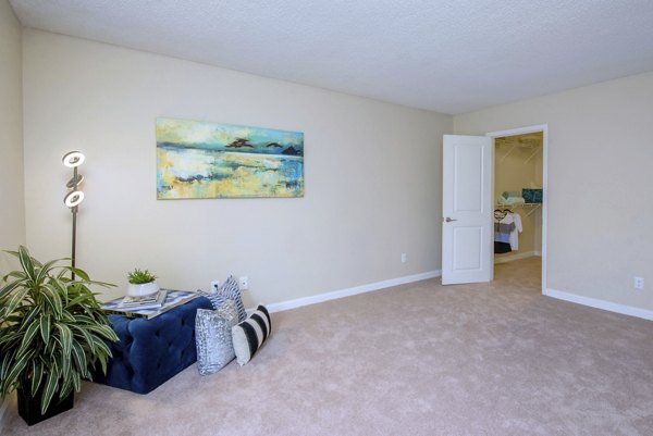 Cozy bedroom with stylish decor at Westmount at Winter Park Apartments: luxury living space showcasing comfort and elegance