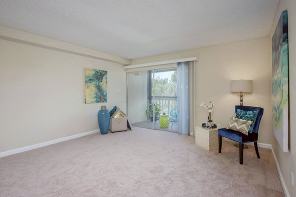 Spacious living room with contemporary design elements in Westmount at Winter Park Apartments