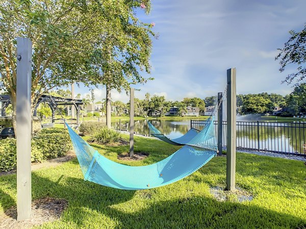Courtyard featuring lush landscaping and seating at Westmount at Winter Park luxury apartments