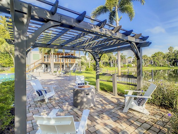 Peaceful courtyard with lush landscaping at Westmount at Winter Park Apartments, ideal for relaxation and outdoor enjoyment