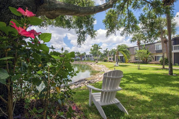 Courtyard featuring lush greenery and seating areas at Westmount at Winter Park Apartments