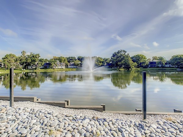 Westmount at Winter Park Apartments: Scenic view of luxury apartments amidst lush greenery