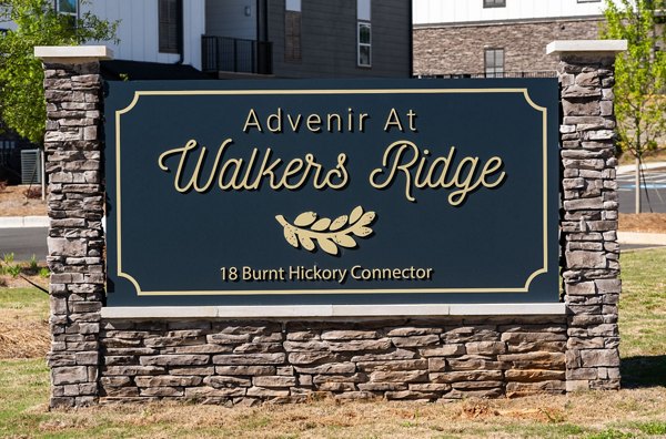 Signage at Advenir at Walker's Ridge Apartments entrance displaying community name and logo