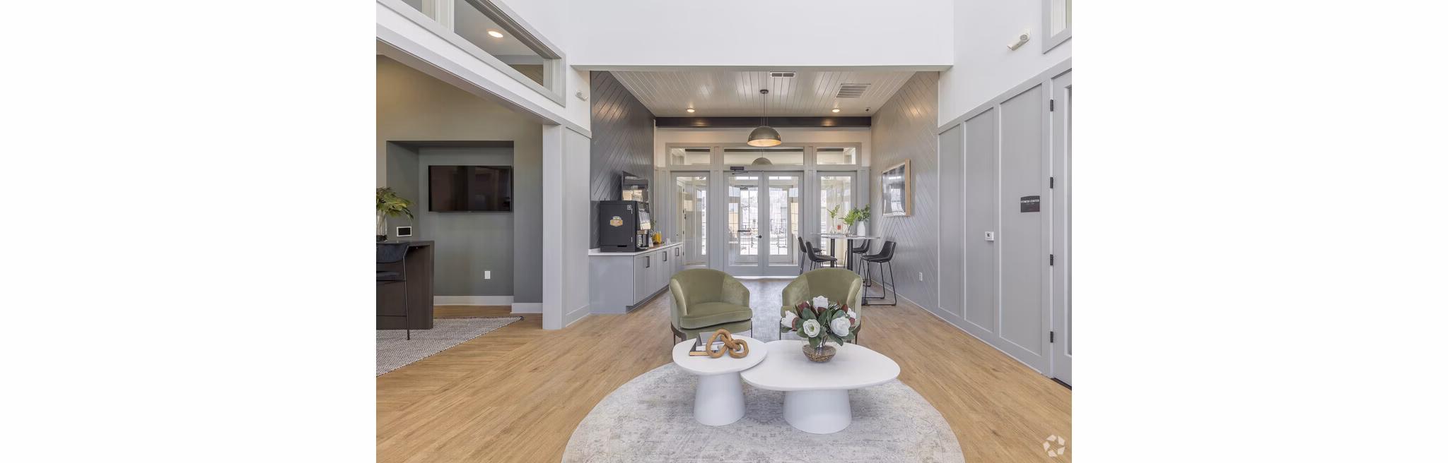 Community clubhouse with modern design at Advenir at Walker's Ridge Apartments, featuring comfortable seating and large windows