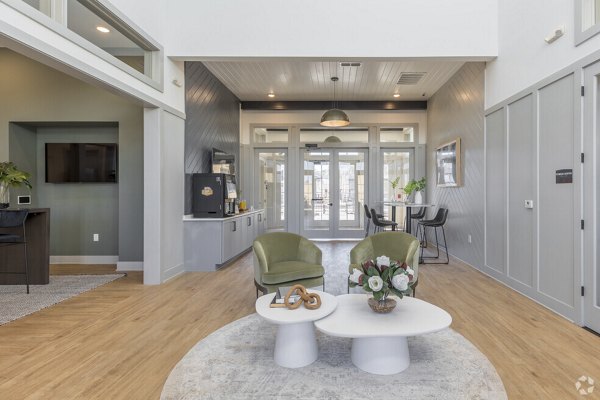 Community clubhouse with modern design at Advenir at Walker's Ridge Apartments, featuring comfortable seating and large windows