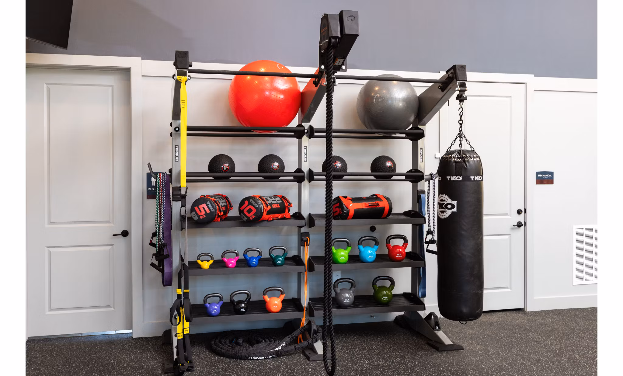 Full-equipped fitness center at Advenir at Walker's Ridge Apartments with modern exercise machines and spacious workout areas